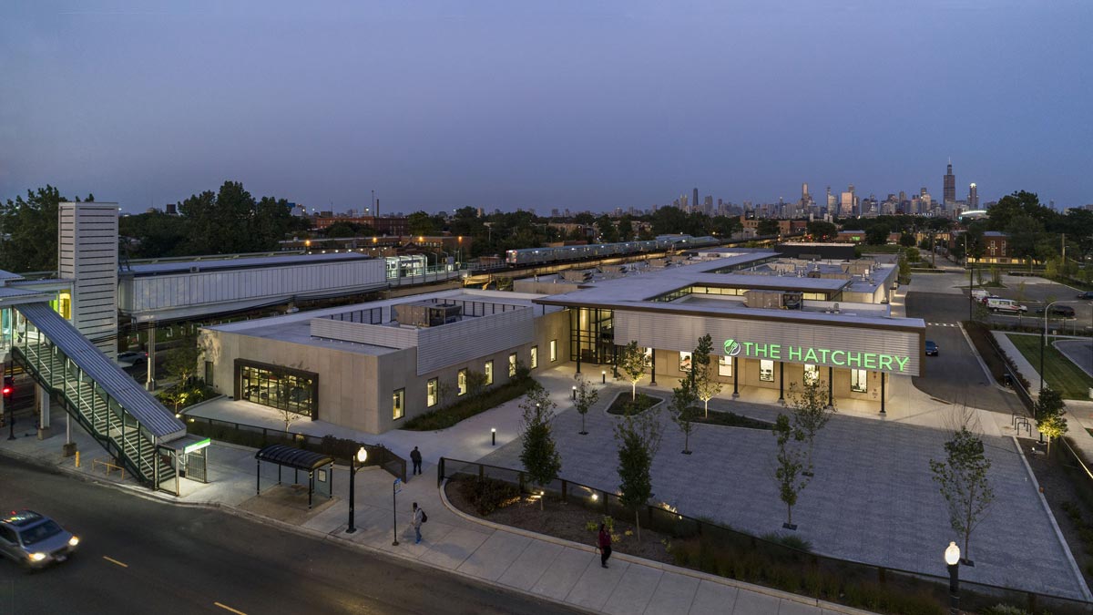 an overhead view of The Hatchery building in early evening with the Chicago skyline in the background.