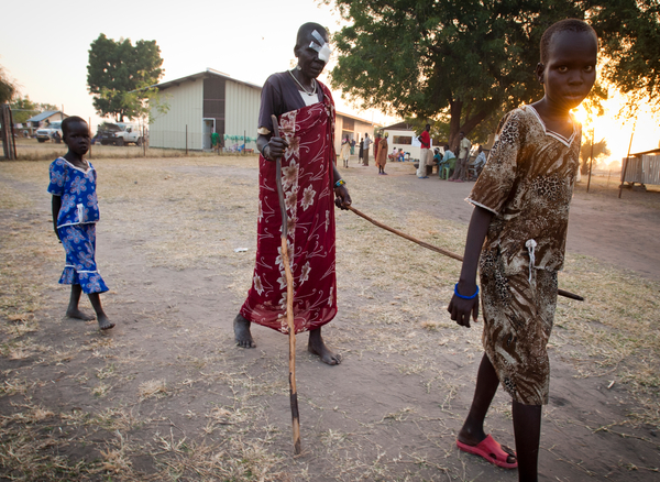 PersonwithstickleadingblindSudanpatient